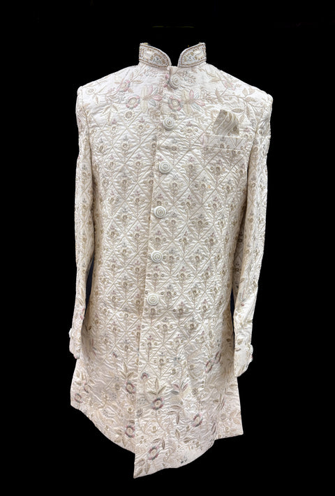 (Video clip attached )Cream Gold Beige color pink color  heavy embroidery work all over with hand work pearl beaded neck, buttons and sleeves design Sherwani and Pants