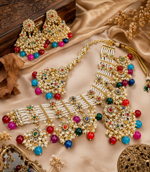 Kundan work beautiful heavy work necklace with designer Jhumka Earrings and Tikka Set featuring delicate pearl detailing and timeless royal charm (slight variation in color and design is possible)