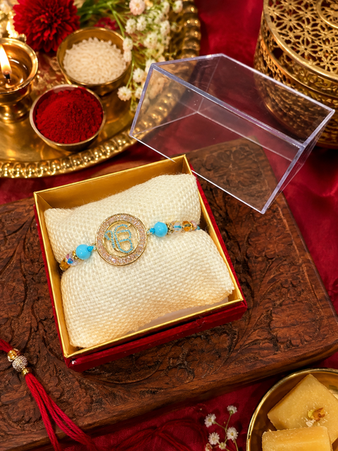 American Diamond Waheguru Rakhi
A beautiful American Diamond Rakhi featuring a divine Waheguru design, symbolizing love, blessings, and spiritual protection. A perfect choice to make Raksha Bandhan extra special.