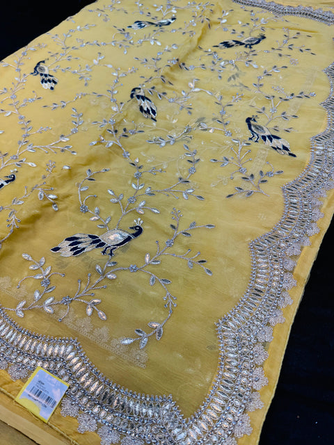 (Video clip attached)Pastel Yellow Colour Heavy Stone Work & Embroidery Jaal Work Beautiful peacock design with gotta Patti work shimmery georgette Designer Saree and embroidery work blouse piece