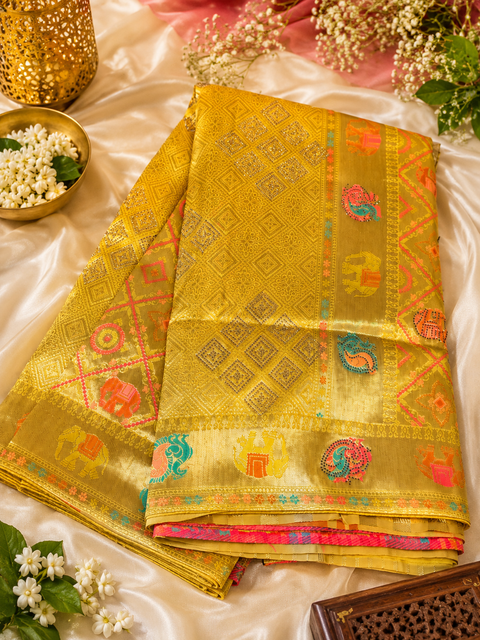 Elephant Peacock design Soft Banarasi Silk brocade saree with stone work and tessels attach on Pallu Model-Worn Blouse Is For Reference Only. Unstitched Blouse Piece Is Attached With Saree(Slight Variation In Color & Design Is Possible)