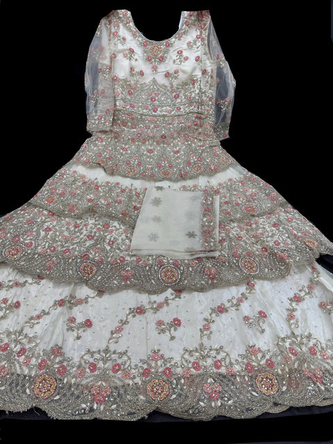 Netting based Golden stones and embroidery work all over front & back of kameez with stone work and beautiful lehnga & netting dupatta (Size 42 and can be altered upto 44)