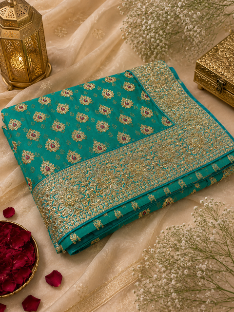 Beautiful Bridal Saree featuring intricate hand embroidery, rich gold zari work and sparkling stone embellishments. ✨Model blouse is for reference only. Blouse piece is attached with the saree. Slight variation in colour and design may occur.
