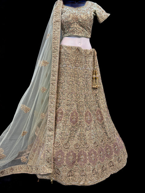 (Video clip attached)SIZE 42 (Upto 46))Lite Mint colour netting Based Beautiful Embroidery Work With Golden Fine Stones& beaded pearl work Very Heavy Layered Designer semi/Bridal Lehnga With Heavy Tessels Attached To Blouse & Lehnga