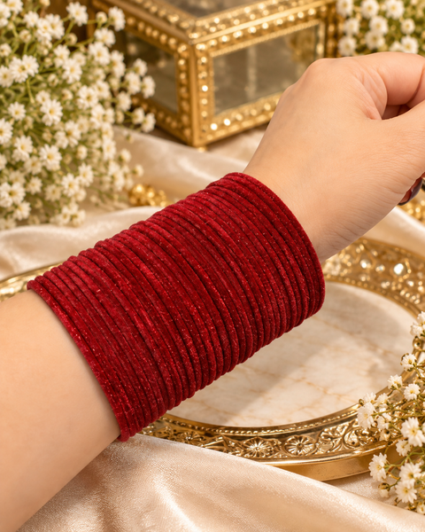 Elegant velvet bangles in a rich Burgundy Red  shade, perfect for festive, bridal and traditional looks. Each pack includes 3 dozen bangles (36 pieces). Price is per pack. Slight variation in colour may be possible