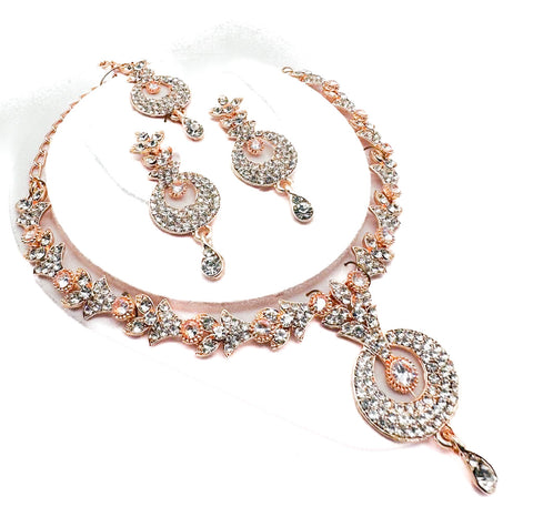 Rose gold color Jerkan stone studded beautiful necklace set with Earrings & Tikka