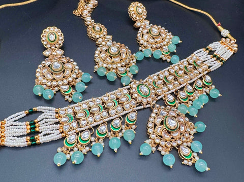 Beautiful Kundan and pearls work classy choker set with beautiful earrings & Tikka