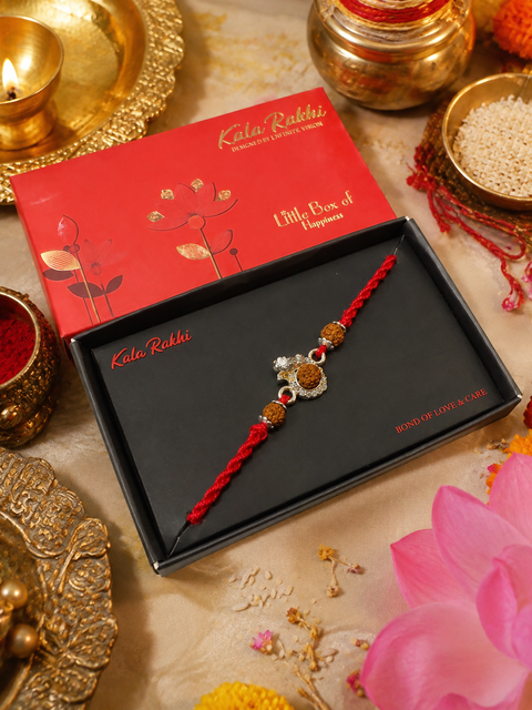Beautiful Ganesha Rakhi featuring a spiritual centrepiece, Rudraksha beads and elegant gold accents. A meaningful choice to celebrate Raksha Bandhan with blessings, love and tradition.