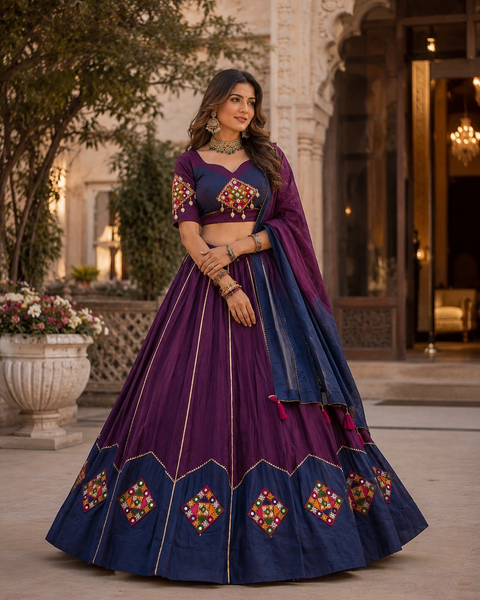 A stunning handcrafted Navratri Lehenga adorned with colourful embroidered patchwork, mirror work, delicate seashell detailing, and a beautifully flared silhouette—perfect for festive celebrations(slight variation in color and design is possible)