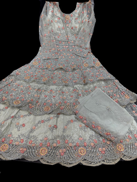Netting based Golden stones and embroidery work all over front & back of kameez with stone work and beautiful lehnga & netting dupatta (Size 42 and can be altered upto 44)