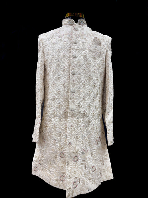 (Video clip attached )Cream Gold Beige color pink color  heavy embroidery work all over with hand work pearl beaded neck, buttons and sleeves design Sherwani and Pants