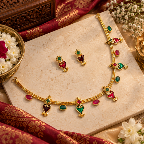 Elegant matte gold-finish green ,Ruby stone accents. Comes with matching earrings(slight variation in color & design may occur)