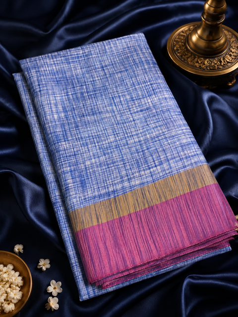 Soft linen-blend saree with a beautiful textured finish and contrast border, offering a graceful blend of comfort and timeless style,Comes with an unstitched running blouse piece attached to the saree (slight variation in color and design is possible