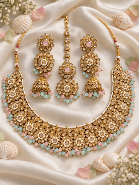 Beautifully crafted with sparkling golden stones, Polki-look stones, and colourful beads. Slight variations in colour and design are possible.