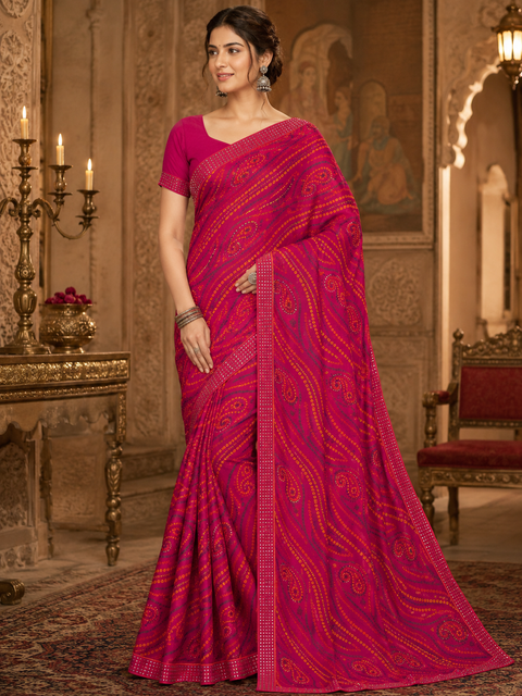 Soft georgette based bandhani print sarees with stones work border. Blouse Worn By The Model Is For Reference Purposes Only. The Blouse Piece Is Attached Separately With The Saree. Slight Variation In Color And Design May occur