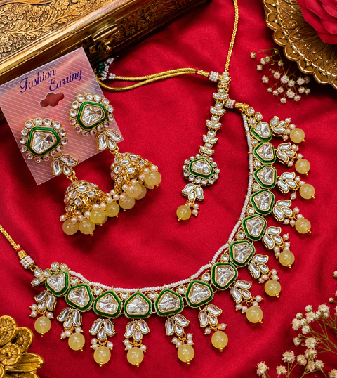Beautiful bigger Kundan and pearls work classy necklace set with beautiful earrings & Tikka