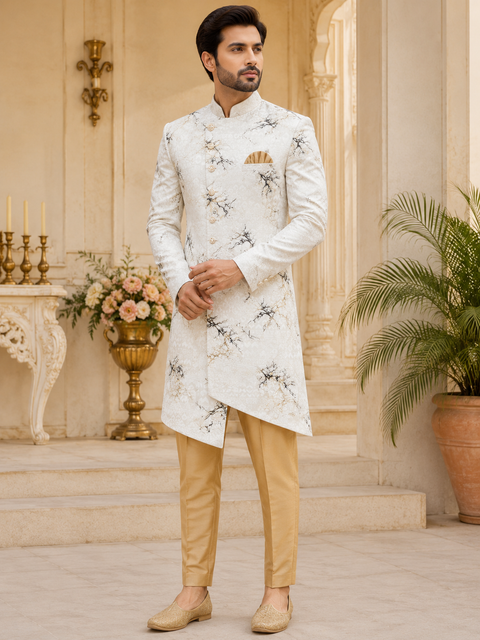 Contemporary ivory Indo-Western with a unique marble-inspired print and modern asymmetric silhouette, perfect for weddings, receptions, and festive occasions. Slight variation in color and design may occur.