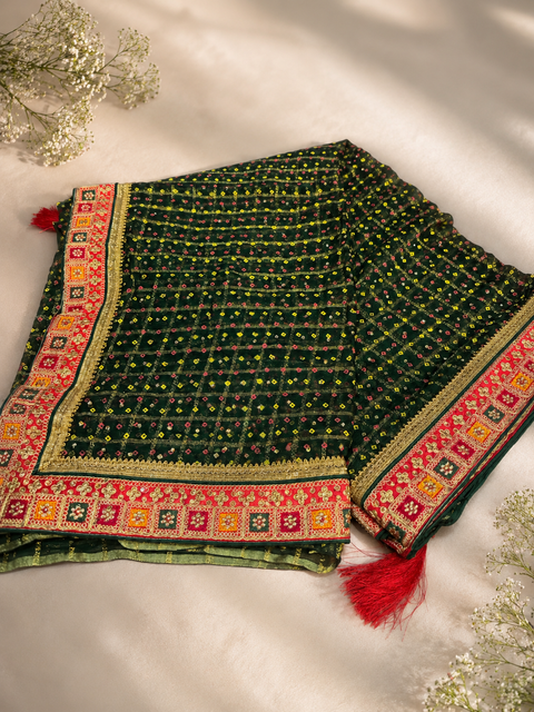 Bandhani print Beautiful Saree with embroidery and stone work border and beautiful design on Pallu with contrast embroidered Blouse. Blouse Piece Attached. Model Image For Reference Only. Slight Variation In Colour And Design May Occur.