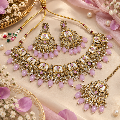 Beautiful polki stones with pearls and colorful stones necklace & earrings with Tikka. Slight variations in colour and design are possible