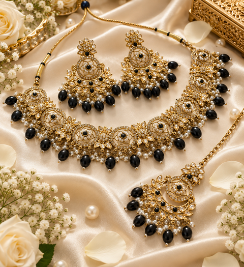 Beautiful polki stones with pearls and colorful stones necklace & earrings with Tikka. Slight variations in colour and design are possible