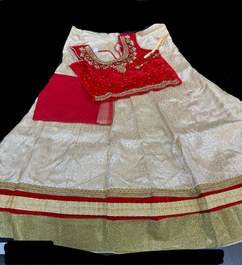 Red colour velvet based stone work blouse with brocade silk lehnga(some red color shades on lehnga )