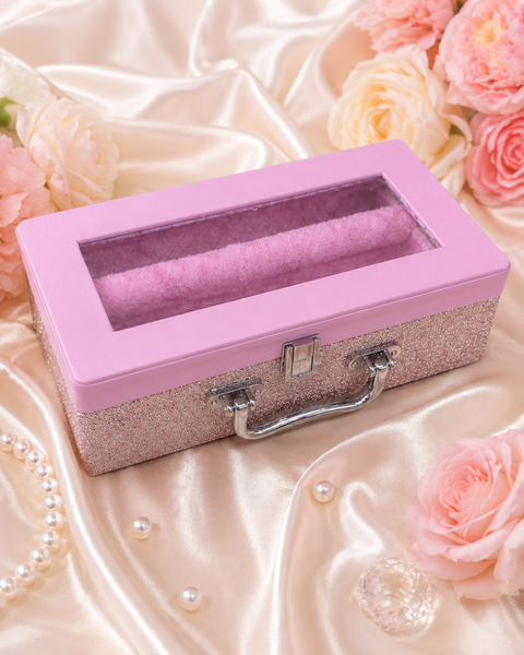 Beautiful pink bangle box with a clear display window, sparkling finish, and soft plush interior with two bangle holders. Stylish, practical, and perfect for keeping your bangles organised and beautifully displayed.
 Approx. Size: 30 × 16× 9 Cm.