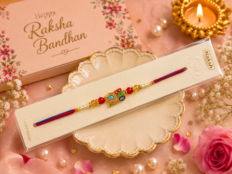 Evil eye Elegant handcrafted Rakhi with premium beads and sparkling stonework, beautifully crafted to celebrate the special bond of love and protection.