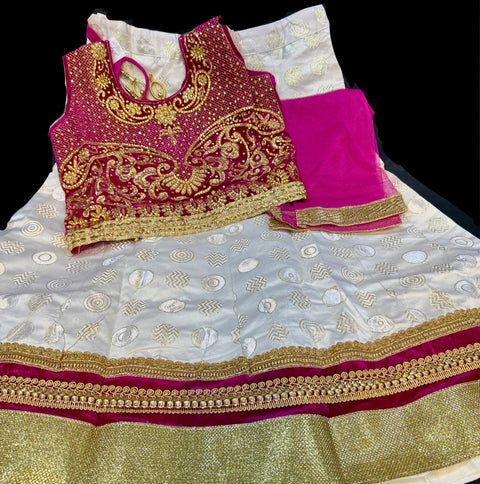 Velvet based heavy stone work blouse with golden cream colour silk lehnga with dupatta