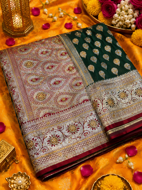 Luxurious Banarasi Silk Saree with rich zari weaving and elegant stone work on the pallu. Comes with an attached blouse piece. Model image is for reference only; slight variation in color and design may occur.