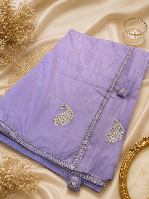 Lavender color soft organza base fabric With Beautiful handwork all over on Saree and border(blouse worn by the model is for reference purposes only. The blouse piece is attached separately with the saree. Slight variation in colou and design is possible)