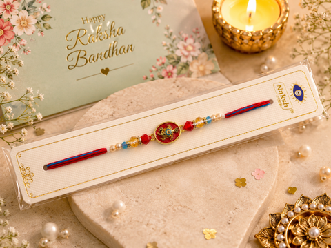 Evil eye Elegant handcrafted Rakhi with premium beads and sparkling stonework, beautifully crafted to celebrate the special bond of love and protection.