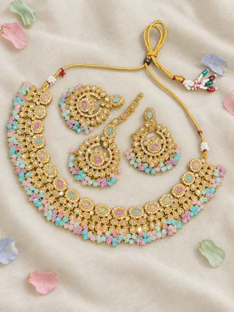 Beautifully crafted with sparkling golden stones, Polki-look stones, and colourful beads. Slight variations in colour and design are possible.