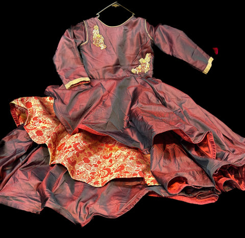 Dark maroon  colour silk based beautiful flared gown