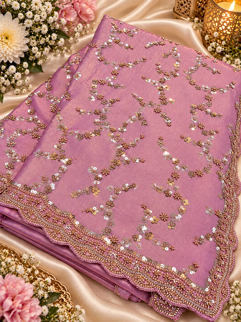 Fendi Silk Saree featuring all-over intricate handwork,sequin detailing and a heavily embellished scalloped border for a rich festive look. Attached blouse piece included; model blouse is for reference only. Slight variation in colour and design may occur