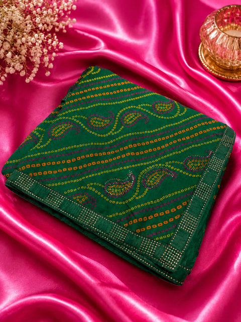 Soft georgette based bandhani print sarees with stones work border. Blouse Worn By The Model Is For Reference Purposes Only. The Blouse Piece Is Attached Separately With The Saree. Slight Variation In Color And Design May occur