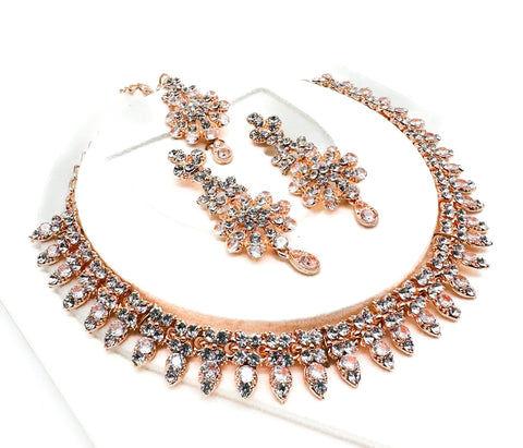Rose gold color Jerkan stone studded beautiful necklace set with Earrings & Tikka