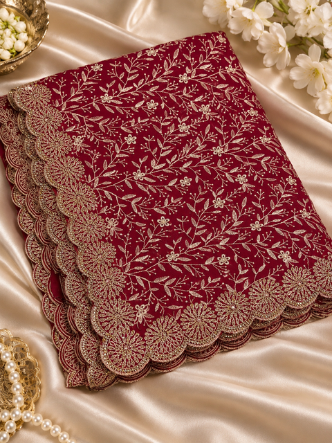 Maroon color pure georgette saree with Kashmiri-inspired soft thread floral embroidery and delicate stone work all over. Finished with a beautifully detailed scalloped border for a rich, elegant look.