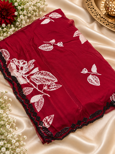 Fendi Silk Saree – Elegant floral print with beautiful black stone handwork border all around. Soft, stylish, two toned shiny. Matching blouse piece attached; model blouse is for reference only. Slight variation in colour/design is possible.