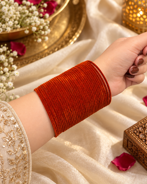 Elegant velvet bangles in a rich Rust Pink shade, perfect for festive, bridal and traditional looks. Each pack includes 3 dozen bangles (36 pieces). Price is per pack. Slight variation in colour may be possible