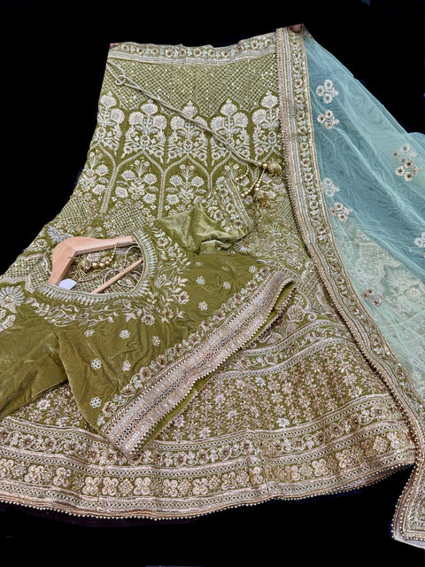 (Video clip attached) Size 40(altered upto 44)Olive colour velvet based heavy flared embroidery & stone work bridal Lehnga with heavy work Mint dupatta