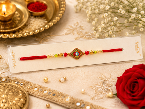 Evil eye Elegant handcrafted Rakhi with premium beads and sparkling stonework, beautifully crafted to celebrate the special bond of love and protection.