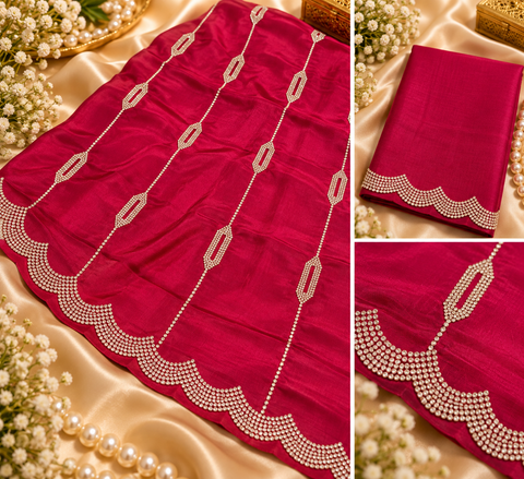 Soft Shiny Georgette Saree with a beautiful flowy drape, elegant stonework lines and a rich scalloped stone border. Attached blouse piece included; model blouse is for reference only. Slight variation in colour and design is possible.