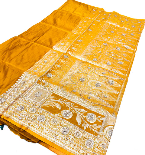 Beautifully designed Banarasi Silk Saree with heavy Handwork with stones & Zari