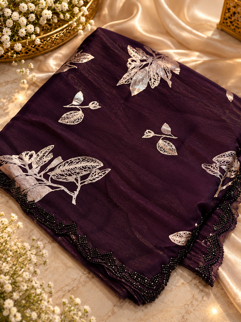 Fendi Silk Saree – Elegant floral print with beautiful black stone handwork border all around. Soft, stylish, two toned shiny. Matching blouse piece attached; model blouse is for reference only. Slight variation in colour/design is possible.