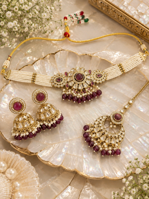 Beautiful Kundan stones with pearls and colorful stones choker necklace & Jhumka with Tikka. Slight variations in colour and design are possible.