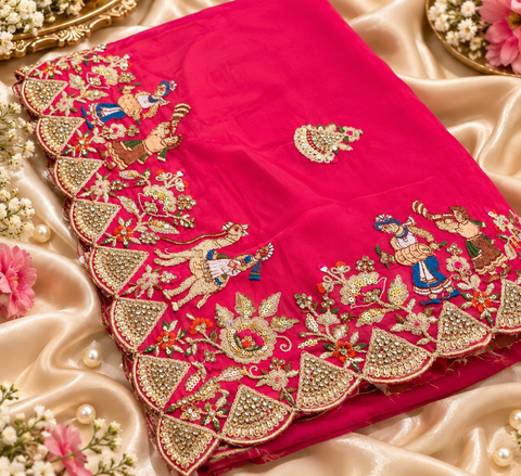 Elegant soft saree featuring intricate traditional figure and floral handwork with a rich scalloped border for a festive statement look. Attached blouse piece included; model blouse is for reference only. Slight variation in colour and design is possible.