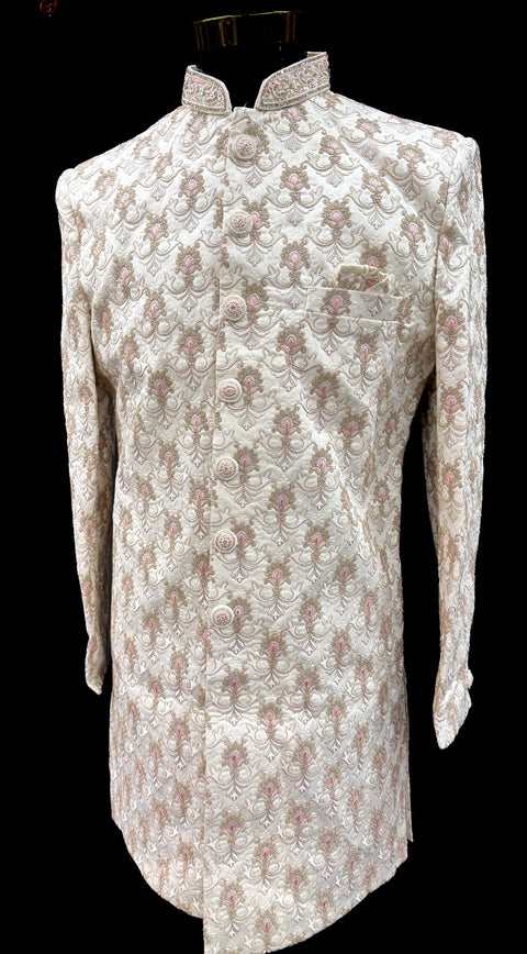 (Video clip attached )Cream gold beige based pastel pink  color heavy embroidery & pearl sequined work all over with hand work pearl beaded neck, buttons and sleeves design Sherwani and Pants