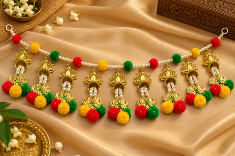 Festive Diwali Door Toran – Beautifully designed with colourful pom-poms, pearl detailing and elegant golden hanging accents. Slight variation in colour and design may occur