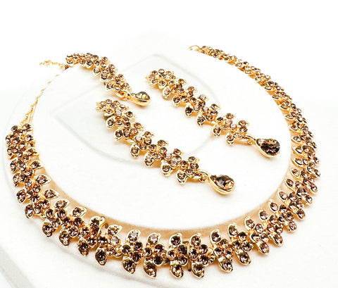Golden color Jerkan stone studded beautiful necklace set with Earrings & Tikka