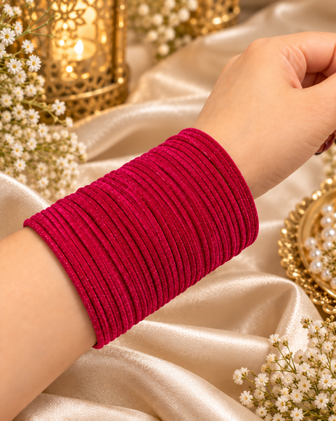 Elegant velvet bangles in a rich Fuchsia Pink shade, perfect for festive, bridal and traditional looks. Each pack includes 3 dozen bangles (36 pieces). Price is per pack. Slight variation in colour may be possible